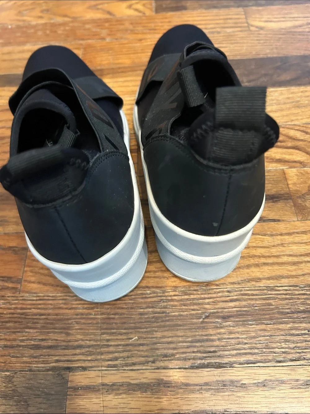 DKNY Black Slip-On Logo-Trim Women’s Sneakers with White Sole
